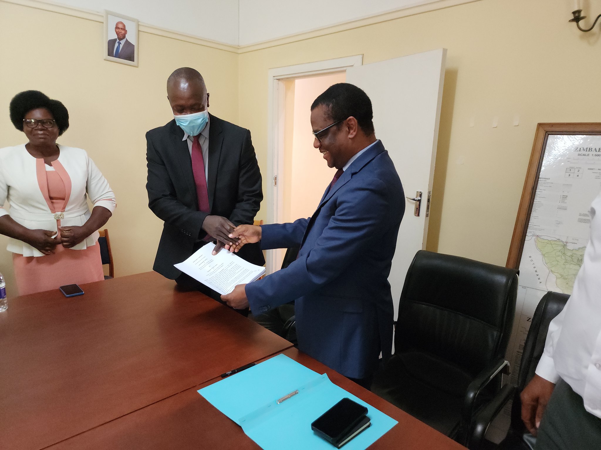 Empower Bank head of business development Mr Enodious Makiwa and ZFU secretary general, Mr Paul Zakariya at the signing ceremony