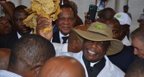  Vice President.Dr. C.G.D.N. Chiwenga auctioning the first bale
